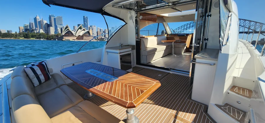 SEADUCTION’s aft dining table with Sydney Opera House beyond