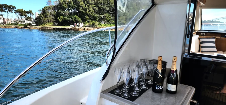 Champagne flutes beside SEADUCTION’s saloon window