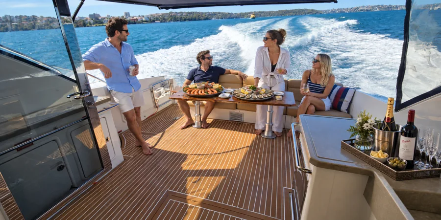 Guests dining together on SEADUCTION’s aft deck