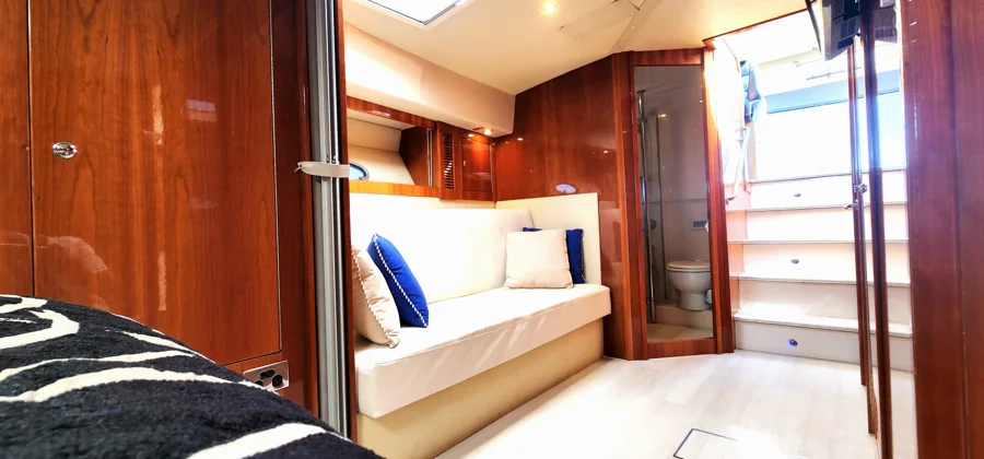 SEADUCTION’s lower lounge with cream seating and timber cabinetry